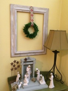 Boxwood wreath hung with Christmas ribbon